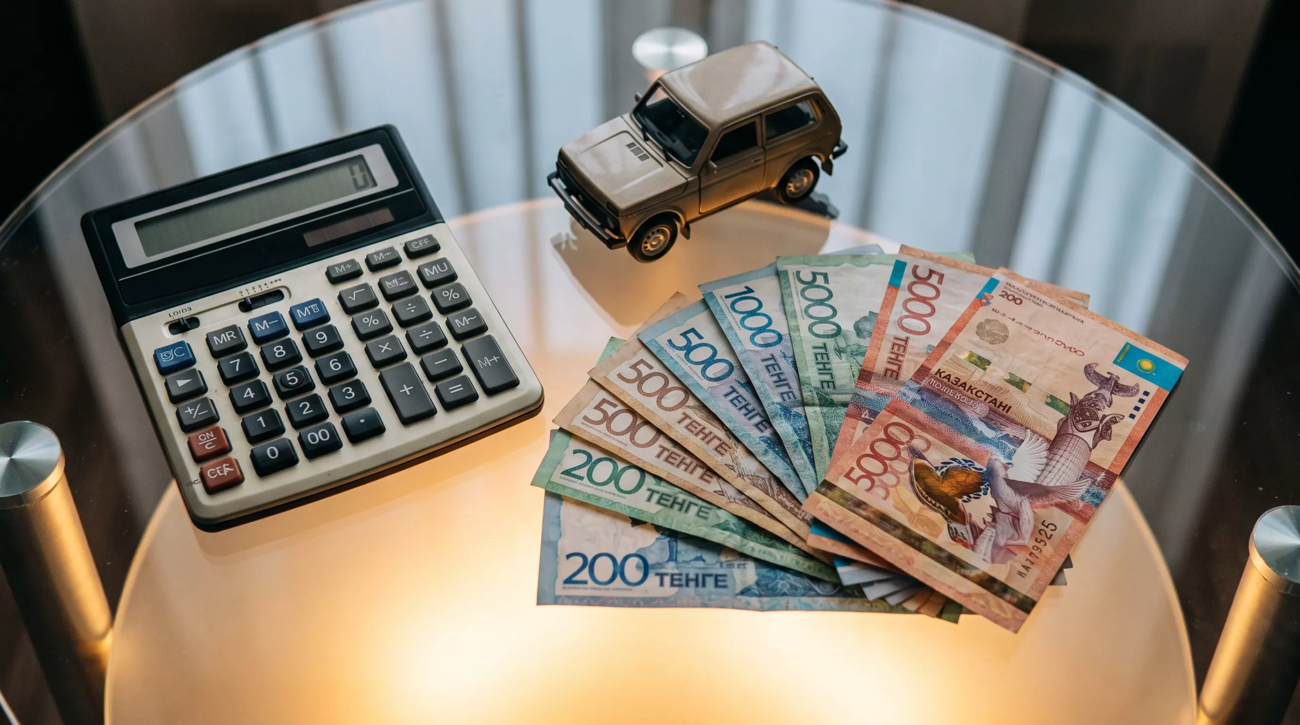 Калькулятор и деньги — расчёт налога при продаже автомобиля в Казахстане